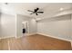 Spacious bedroom with luxury vinyl plank flooring, ceiling fan, and ensuite bathroom at 1208 Thomas Rd, Decatur, GA 30030