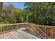 Wooden deck showcasing natural wood and surrounded by green lush trees at 1208 Thomas Rd, Decatur, GA 30030
