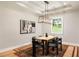 Elegant dining room featuring modern lighting, stylish rug, and a large window at 1208 Thomas Rd, Decatur, GA 30030