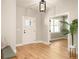 Bright entryway with hardwood floors, white door, and view into adjacent room at 1208 Thomas Rd, Decatur, GA 30030