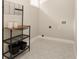 Clean laundry room with modern shelving and stylish geometric tile flooring at 1208 Thomas Rd, Decatur, GA 30030
