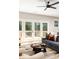 Bright living room featuring a comfortable blue sofa and access to an outdoor deck at 1208 Thomas Rd, Decatur, GA 30030