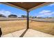 Large backyard with full perimeter fence and covered patio. Landscape is dormant/ awaiting spring at 263 Osier Dr, Mcdonough, GA 30252