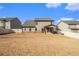 Spacious backyard with privacy fence, covered patio, and ample room for outdoor activities at 263 Osier Dr, Mcdonough, GA 30252