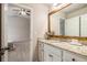 Bright bathroom with granite counters and a view to bedroom with vaulted ceiling and ceiling fan at 263 Osier Dr, Mcdonough, GA 30252