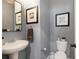 Elegant bathroom with a soaking tub, dual vanities, and decorative mirrors at 263 Osier Dr, Mcdonough, GA 30252