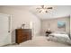 Spacious bedroom with vaulted ceiling, large window and carpet. Double doors lead to other rooms at 263 Osier Dr, Mcdonough, GA 30252