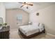 Cozy bedroom with carpet, vaulted ceiling, ceiling fan, and large window allowing ample natural light at 263 Osier Dr, Mcdonough, GA 30252
