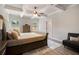Comfortable bedroom with a tray ceiling, a neutral color scheme, and wood floors at 263 Osier Dr, Mcdonough, GA 30252