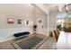 Foyer featuring natural light, wainscoting, decor, rug, and bench at 263 Osier Dr, Mcdonough, GA 30252