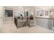 Upstairs hallway, with black iron staircase and a view of the upstairs area at 263 Osier Dr, Mcdonough, GA 30252