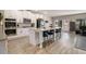 Spacious kitchen with white cabinets, island with seating, and stainless appliances at 263 Osier Dr, Mcdonough, GA 30252