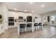 Bright kitchen featuring white cabinetry, a large center island, and stainless steel appliances at 263 Osier Dr, Mcdonough, GA 30252