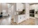 Open kitchen with stainless steel appliances, granite countertops, and wood floors at 263 Osier Dr, Mcdonough, GA 30252