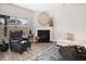 Cozy living room with fireplace, hardwood floors, and natural light at 263 Osier Dr, Mcdonough, GA 30252