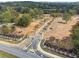 Aerial view of a community entrance with landscaping, signage, and stone pillars at 4525 Muskogee Ct, Cumming, GA 30040