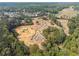 Aerial view of a house under construction in a new community near a pond at 4525 Muskogee Ct, Cumming, GA 30040