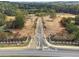 Grand community entrance lined with trees and decorative fences in a quiet setting at 4525 Muskogee Ct, Cumming, GA 30040