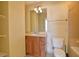 Bathroom with wood vanity, toilet, and combination shower and tub at 57 Forsyth Nw St # 4H, Atlanta, GA 30303