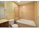 Clean bathroom featuring a soaking tub, toilet, and vanity with marble countertop at 57 Forsyth Nw St # 4H, Atlanta, GA 30303