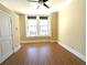 Cozy bedroom featuring hardwood floors, large windows, and crown molding at 57 Forsyth Nw St # 4H, Atlanta, GA 30303
