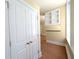 Hallway featuring hardwood floors and a built-in bookshelf at 57 Forsyth Nw St # 4H, Atlanta, GA 30303