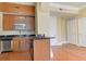 Kitchen area with stainless steel appliances, wooden cabinets and hardwood floors at 57 Forsyth Nw St # 4H, Atlanta, GA 30303