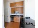 Kitchen featuring wooden cabinets, stainless steel appliances, and black countertops at 57 Forsyth Nw St # 4H, Atlanta, GA 30303