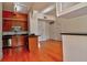 Well-lit kitchen with stainless steel appliances, wooden cabinetry, and hardwood floors at 57 Forsyth Nw St # 4H, Atlanta, GA 30303
