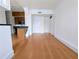 Open living room with wood floors, recessed lighting, and a partial kitchen view at 57 Forsyth Nw St # 4H, Atlanta, GA 30303