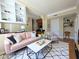 Stylish living room with white shelving, comfortable seating, and hardwood floors at 57 Forsyth Nw St # 4H, Atlanta, GA 30303