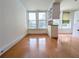 Empty living room with hardwood floors, recessed lighting, and many large windows at 57 Forsyth Nw St # 4H, Atlanta, GA 30303