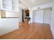 Living room with hardwood floors, white trim, and half wall between the living room and the kitchen at 57 Forsyth Nw St # 4H, Atlanta, GA 30303