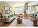 Bright living room with hardwood floors, large windows, and stylish modern furnishings at 57 Forsyth Nw St # 4H, Atlanta, GA 30303