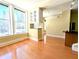 Bright living room featuring hardwood floors, large windows, and a built-in bookshelf at 57 Forsyth Nw St # 4H, Atlanta, GA 30303