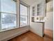 Inviting living space featuring large windows, lots of light, and built-in shelves at 57 Forsyth Nw St # 4H, Atlanta, GA 30303
