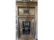 Close-up of an ornate vintage mailbox with black and gold details at 57 Forsyth Nw St # 4H, Atlanta, GA 30303