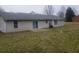 The backyard with a patio features a well-maintained lawn, and mature trees at 10 Oak Wood Ln, Covington, GA 30016