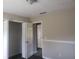 A bedroom featuring neutral walls, trim accents, and a closet at 10 Oak Wood Ln, Covington, GA 30016