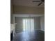 Bright and airy living room featuring a ceiling fan, hardwood-style floors, and large sliding glass door at 10 Oak Wood Ln, Covington, GA 30016