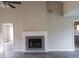 Spacious living room with a fireplace, neutral walls, and modern flooring at 10 Oak Wood Ln, Covington, GA 30016