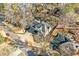 Aerial view of house with asphalt roof, driveway, and mature trees in established neighborhood at 2833 Landing Way, Marietta, GA 30066