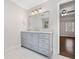 Bathroom featuring a gray vanity, marble countertops, and glass shower at 2833 Landing Way, Marietta, GA 30066