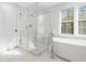 Bright bathroom featuring a soaking tub, glass shower, and large windows at 2833 Landing Way, Marietta, GA 30066