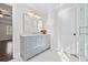Bathroom featuring a gray vanity, marble countertops, and glass shower at 2833 Landing Way, Marietta, GA 30066