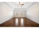 Spacious bedroom with laminate floors, tray ceiling, and natural light at 2833 Landing Way, Marietta, GA 30066