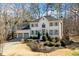 Beautiful two-story home with landscaped front yard and attached two-car garage in wooded area at 2833 Landing Way, Marietta, GA 30066