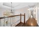 Bright hallway with hardwood floors and a decorative chandelier at 2833 Landing Way, Marietta, GA 30066
