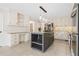 Stylish kitchen with island, granite counters, built-in desk, and stainless steel appliances at 2833 Landing Way, Marietta, GA 30066