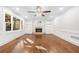 Bright living room boasts hardwood floors, built-in shelves, fireplace, and large window at 2833 Landing Way, Marietta, GA 30066